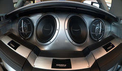 Car trunk with subwoofers, speakers and amps.
